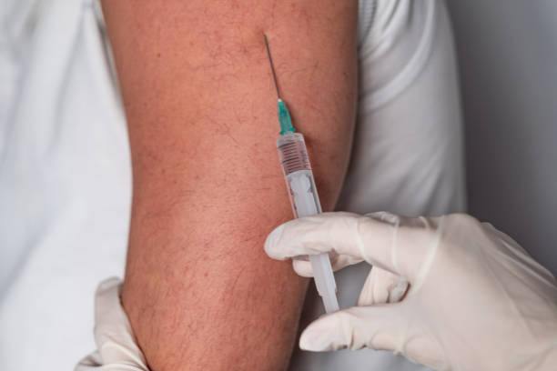 istock Close up men is receiving vaccine 1297863877