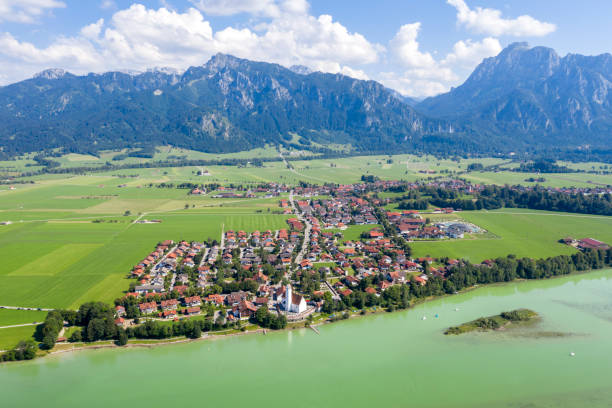 istock Village between lake and mountains, aerial view 1297868117