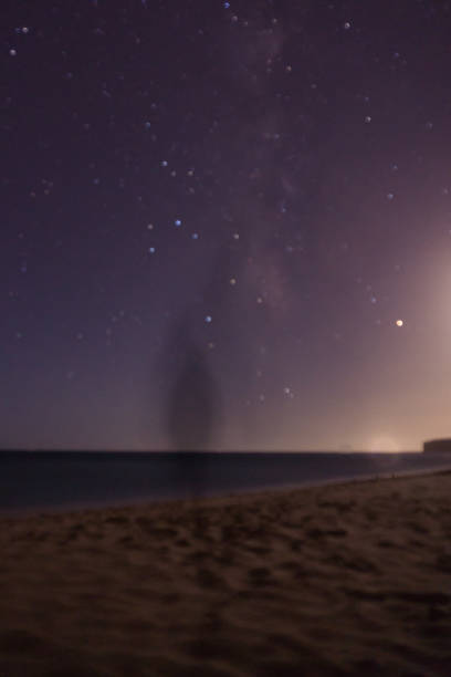 istock Ghost at the beach at night with stars 1297871014