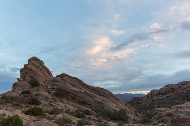 istock Stone formation and blue cloudy sky in Vasquez Rocks, California 1297871752