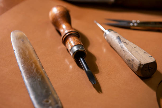 istock many tools of the leather craftsman, 1297872077