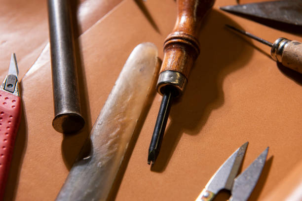 istock many tools of the leather craftsman, 1297872839