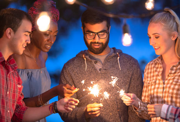 istock Friends lighting up sparklers during hang out session 1297875739