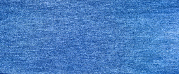 istock Close up of blue jeans texture  background. 1297878324