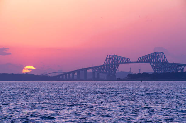 istock Large Sunset Next to Tokyo Gate Bridge in Japan 1297886301