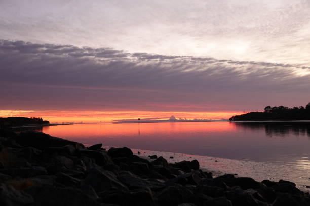 istock Sun setting over the water on Queensland 1297896164