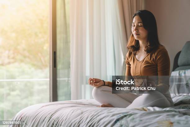 Asian Chinese Woman Meditating At Bedroom Stock Photo - Download Image Now - Meditating, Zen-like, Healthy Lifestyle
