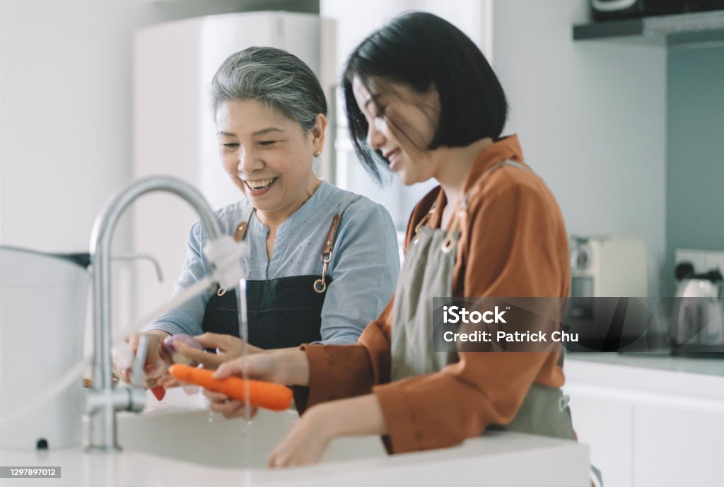 asian chinese grandma and daughter preparing breakfast at kitchen kitchen Senior Adult Stock Photo