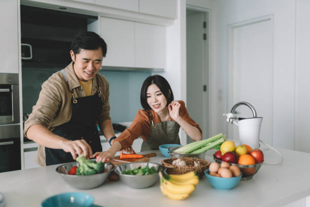 istock asian chinese couple preparing breakfast at kitchen 1297897069