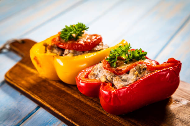 istock Roasted stuffed pepper with minced-meat and rice on wooden table 1297898696