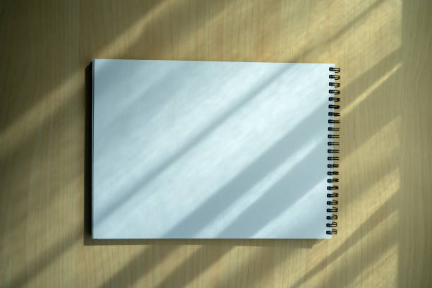 istock Blank plain notebook top view blank Design concept background for mockup book  page with stationary Blank plain notebook 1297900309