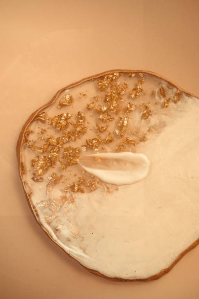 Cosmetic cream smear on golden background minimalism