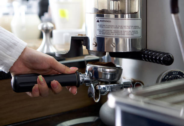 istock Barista making fresh espresso coffee. Espresso Machine Portafilters (Closeup). 1297904609