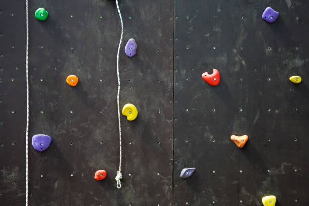 istock Climbing gym Colorful footholds for training active . 1297904976