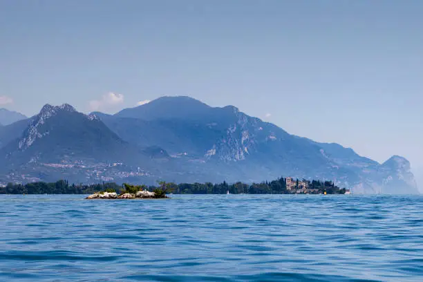 Panoramic view of the southern part of Lake Garda with Island Garda. Region of Sirmione in Italy.