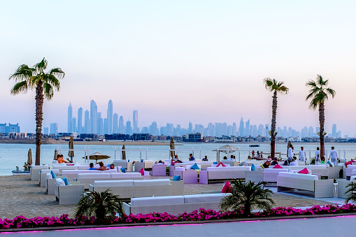 Dubai/UAE - December 11, 2014: having dinner outside the Atlantis resort - the Jumeirah Palm overdosing the cityscape of Dubai.