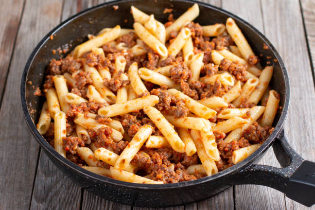 istock Pasta with minced meat. A traditional naval dish 1297907984