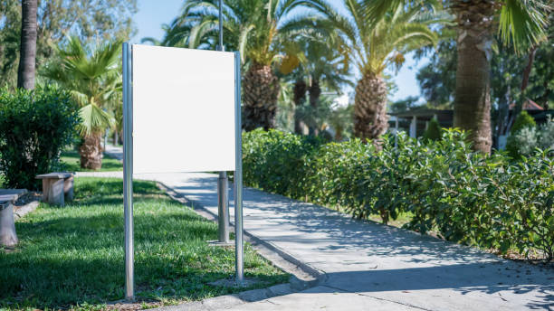 istock Information stand in white empty frame on sidewalk of hotel territory 1297909837