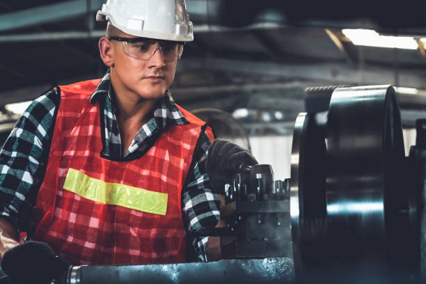 istock Smart factory worker or engineer do machine job in a manufacturing workshop 1297911574
