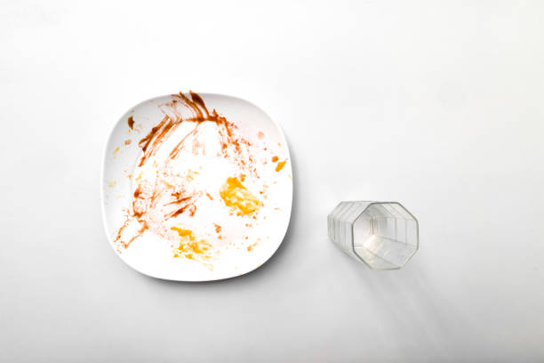 istock food plates and drinking glasses on white background after eating 1297911632