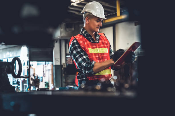 istock Manufacturing worker working with clipboard to do job procedure checklist . 1297912780