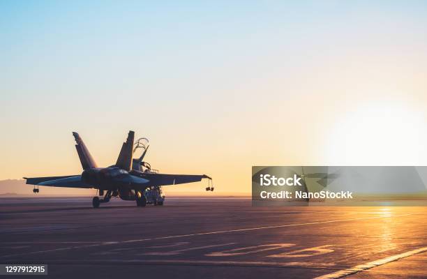 Jet Fighter On An Aircraft Carrier Deck Against Beautiful Sunset Sky Stock Photo - Download Image Now