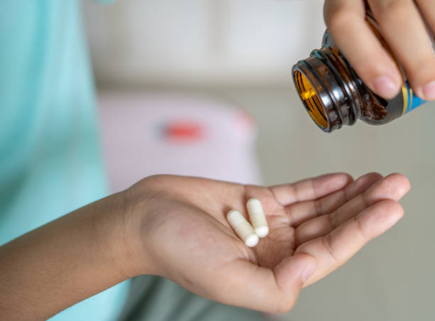 istock Human Hand with Medical Pill 1297918957