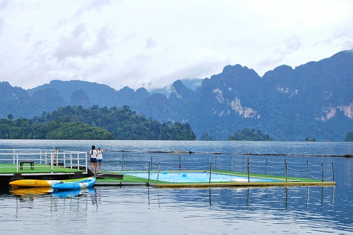 Long-tail boat in the reservoir of Ratchaprapha dam or Khao Sok National Park, Surat Thani, Thailand.