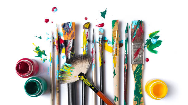istock Different size used brushes with colorful paint for art 1297922314