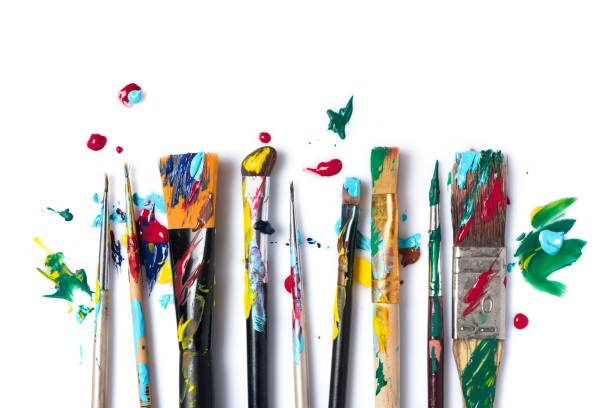 istock Different size used brushes with colorful paint for art 1297922330