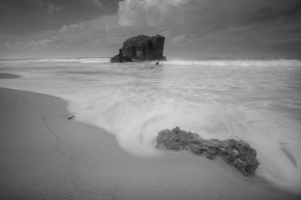istock Long Exposure Image Of Waves On Seashore 1297923128