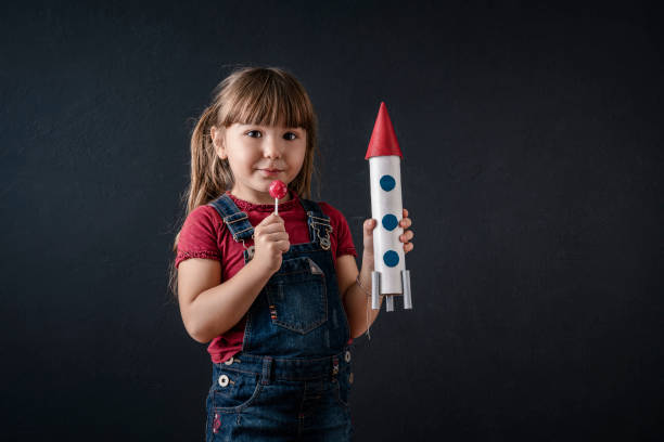 istock Young Business Girl with Rocket Pack 1297926573