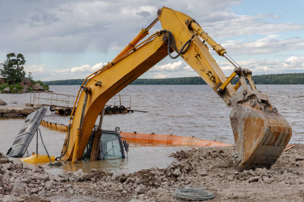 istock Excavator drowned on the lake while working to strengthen the shore 1297927087