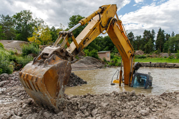 istock Excavator drowned on the lake while working to strengthen the shore 1297927089