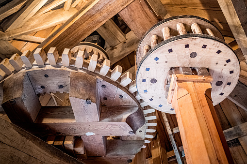 Radars and rotating parts of a traditional wooden windmill for grinding grain and flour