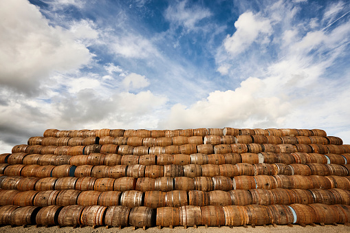 Barrels await reconditioning outside of a cooperage in Scotland