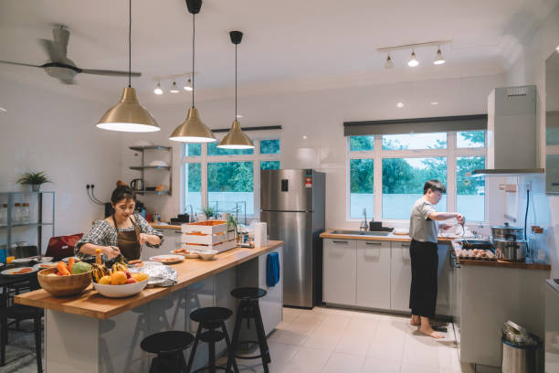istock asian chinese siblings preparing meal together at kitchen 1297932187