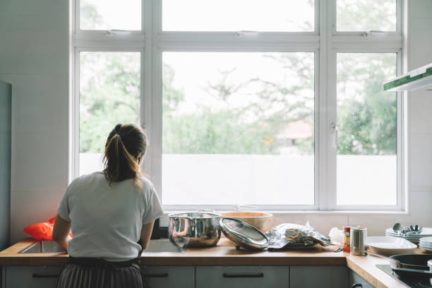 istock asian chinese mother washing dishes at kitchen 1297933302