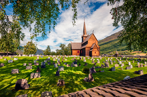 Picturesque summer view of Lom stave church (Lom Stavkyrkje). Sunny morning scene of Norwegian countryside, administrative centre of Lom municipality - Fossbergom, Norway, Europe.