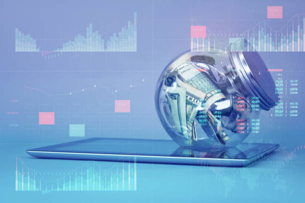 istock Business analytics with key performance indicators dashboard concept. Dollar bills in a glass piggy bank on a tablet. 1297936720