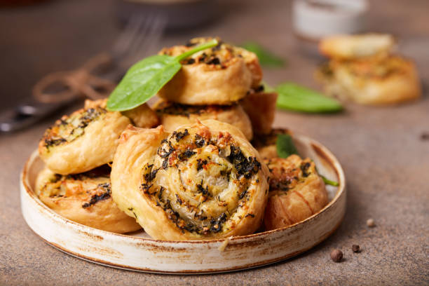 istock Puff pastry Pizza rolls with spinach, chicken meat and cheese 1297938628