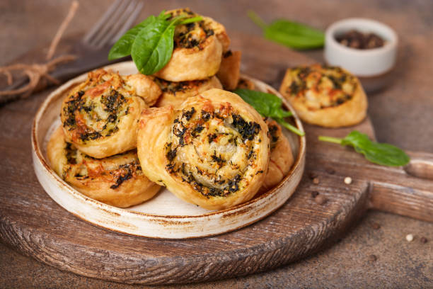 istock Puff pastry Pizza rolls with spinach, chicken meat and cheese 1297938636