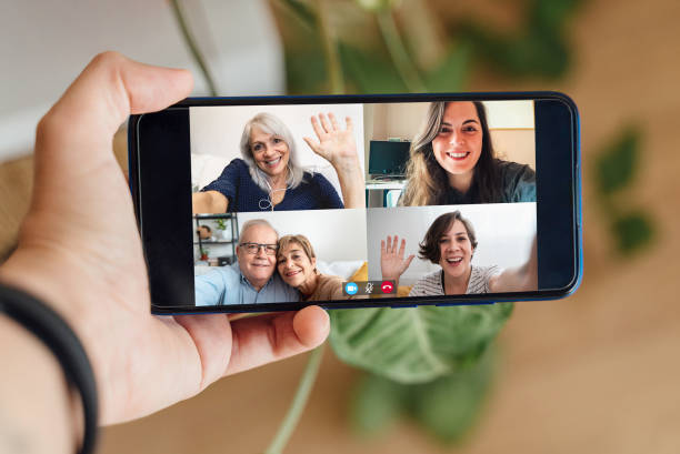 istock Multigeneration people having video call with mobile phone during lockdown isolation - Social distance concept 1297941203