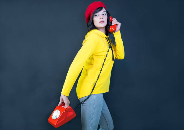 stylish woman and retro phone