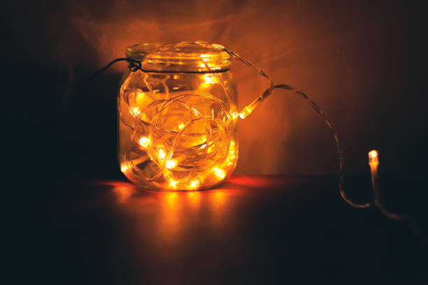 istock Transparent jar with led lights inside and Bokeh lights in background. Home decoration 1297942768