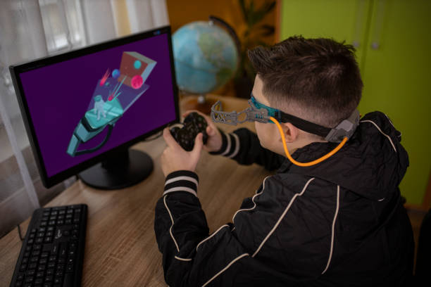 istock Young boy plays video games with 3d eyeglasses 1297944844