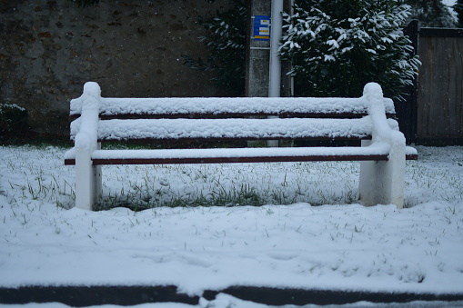 Snow-covered bench