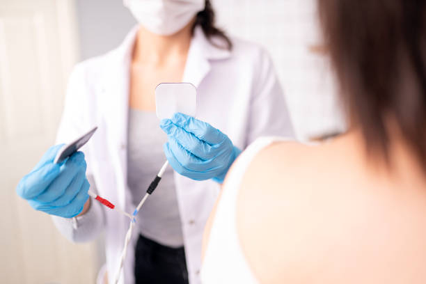 istock Female physiotherapist is examining to her patient. 1297947869