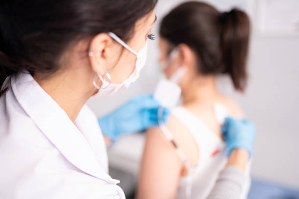 istock Female physiotherapist is examining to her patient. 1297947880