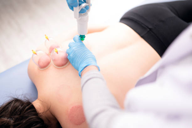 istock Female physiotherapist is examining to her patient. 1297947912